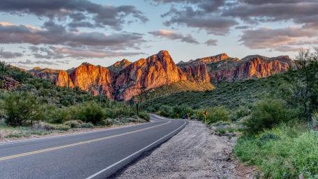 Majestic Mountain Road at Sunset wallpaper