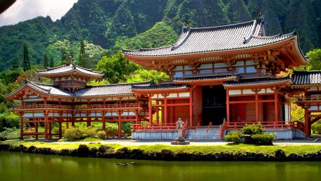 Serene Pagoda Surrounded by Lush Mountains in China wallpaper