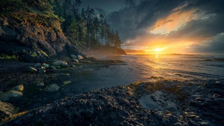 Serene Sunset Over Rugged Coastline wallpaper