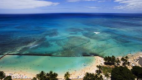 Serene Aerial View of Crystal Clear Ocean Waters wallpaper