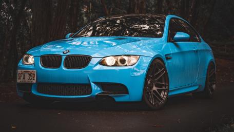 Sleek Blue BMW in the Forest wallpaper