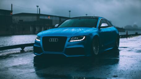 Dreamy Audi in a Rainy Urban Landscape wallpaper