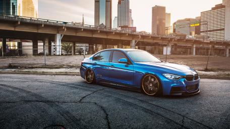 Sleek Blue Dream Car on Urban Streets wallpaper