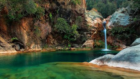 Serene Waterfall in a Hidden Lagoon wallpaper