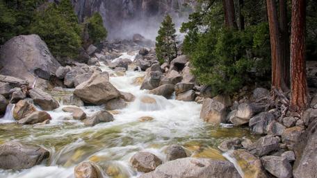 Tranquil Mountain Stream in Nature's Embrace wallpaper