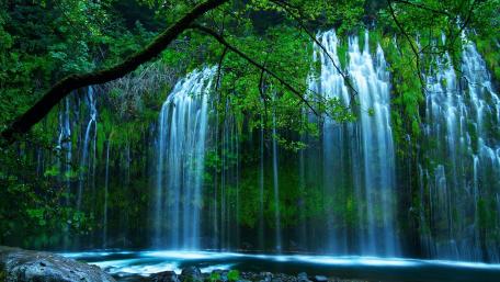 Serenity of Waterfalls Amidst Lush Greenery wallpaper