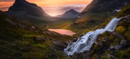 Serene Mountain Valley at Dusk with Waterfall and Lake wallpaper