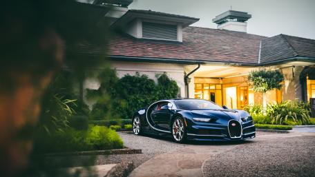 Sleek Luxury Car in Elegant Setting wallpaper