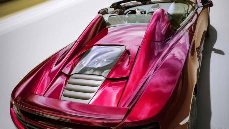 Sleek Red Convertible Driving Fast on Open Road wallpaper