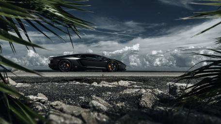 Sleek Elegance of a Black Supercar wallpaper