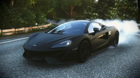 Sleek Black McLaren on the Open Road wallpaper