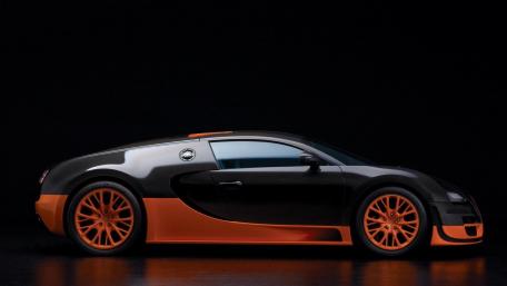 Sleek Black and Orange Supercar Wallpaper wallpaper