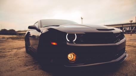 Sleek Black Car on the Open Road wallpaper