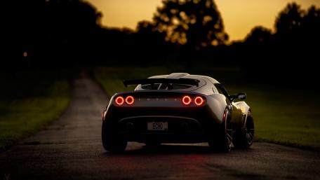 Sleek Lotus at Sunset Roadside Adventure wallpaper