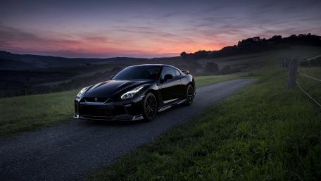 Sleek Performance Under a Vibrant Sunset Glow wallpaper