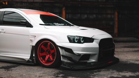 Sleek White Car with Red Accents and Custom Modifications wallpaper