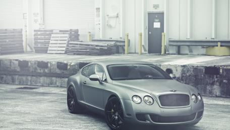 Sleek Bentley Parking in Urban Setting wallpaper