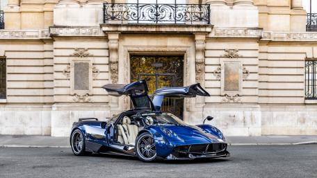 Stunning Blue Pagani with Elegant Architecture Background wallpaper