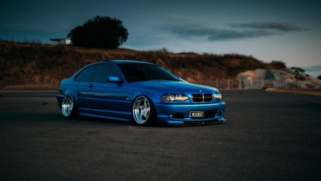 Sleek Blue BMW in a Modern Setting wallpaper
