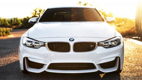 Sleek White BMW with Sunset Glow wallpaper