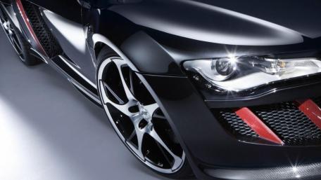 Sleek Black Sports Car Wallpaper Enhancing Style and Performance wallpaper