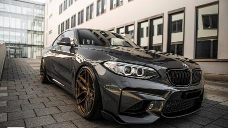 Sleek BMW Coupe in Urban Setting wallpaper