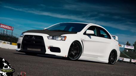 Sleek White Sports Car on the Track wallpaper