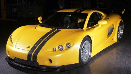 Vibrant Yellow Supercar Wallpaper Featuring Sleek Design and Style wallpaper