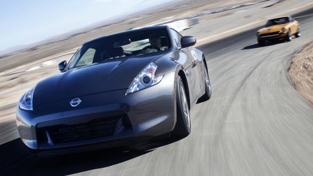 Dynamic Racing Moments with Nissan Cars wallpaper