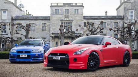 Dynamic Sports Cars in an Elegant Setting wallpaper