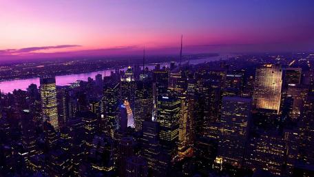 Stunning Cityscape at Dusk with Vibrant Purple Sky wallpaper