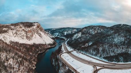 Winter Roadway Through Majestic Mountain Valley wallpaper