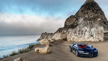 Sleek Bugatti Chiron by Serene Coastal Cliffs wallpaper