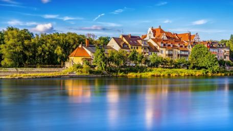 Charming Riverside View of a Picturesque Cityscape wallpaper