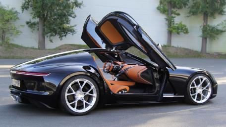 Sleek Black Car with Stylish Orange Interior wallpaper