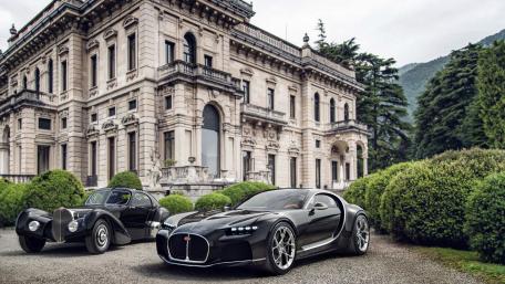 Elegant Cars Against a Majestic Mansion Scene wallpaper