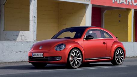 Stylish Red Volkswagen Beetle Wallpaper wallpaper