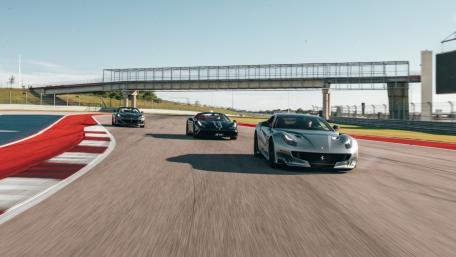 Thrilling Race of Iconic Ferraris at the Track wallpaper