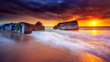 Vibrant Colors of Sunset at the Seashore wallpaper