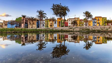 Vibrant City Reflections on Still Waters wallpaper