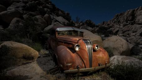 Forgotten Classic Car Among the Rocks wallpaper