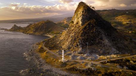 Majestic Lighthouse by the Serene Coastline wallpaper