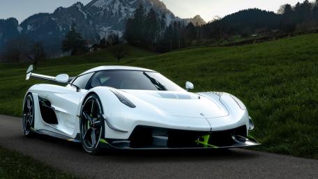 Sleek Supercar in Scenic Mountainscape wallpaper