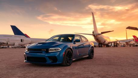 Sleek Blue Muscle Car at Sunset wallpaper