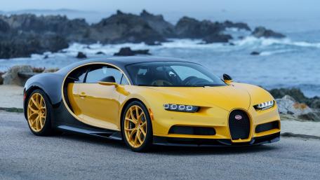 Sleek Yellow and Black Sports Car Wallpaper wallpaper