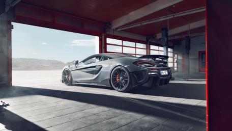 Sleek McLaren in a Racing Environment wallpaper