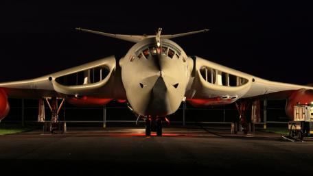 Sleek Aircraft Illuminated at Night wallpaper