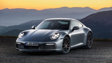 Sleek Porsche Beauty Against a Dusk Horizon wallpaper