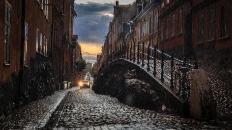 Charming Cobblestone Street on a Rainy Day wallpaper