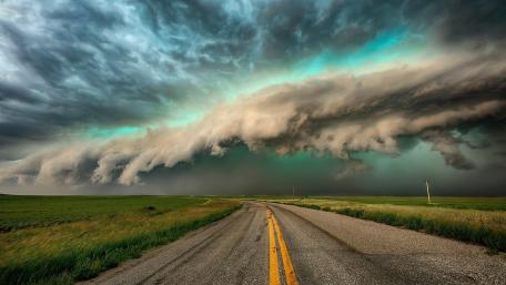 Majestic Road Under Stormy Skies wallpaper